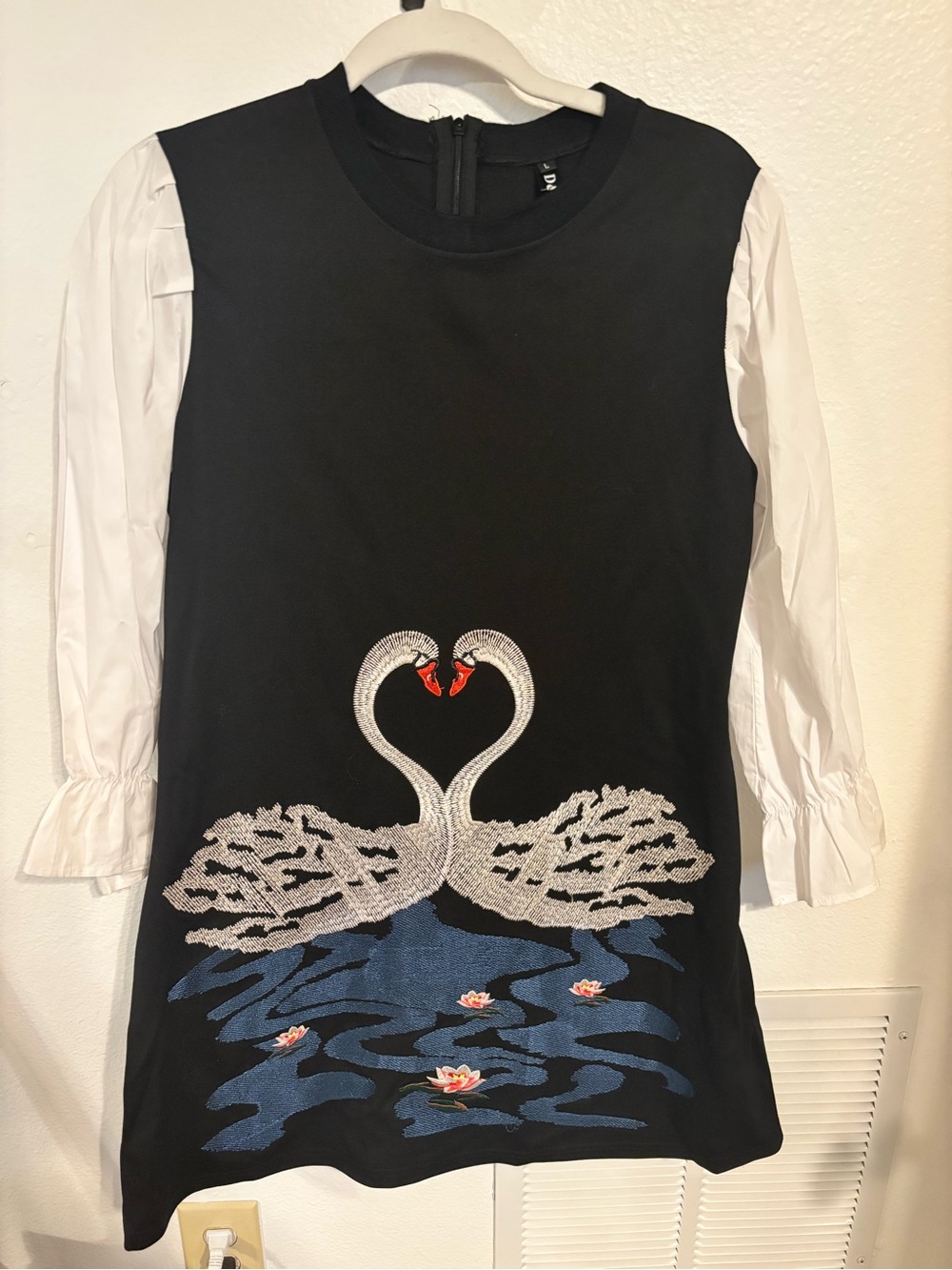 Black Dress with White Puff Sleeves and Swan Embroidery
